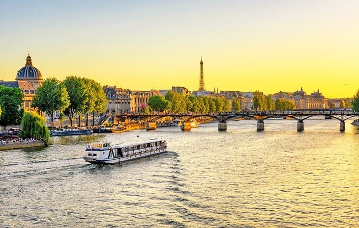 france paris attractions seine river cruise at sunset for 10 Top-Rated Tourist Attractions in Paris