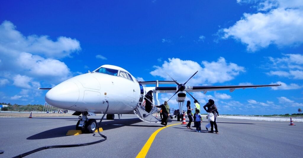 A family boarding an aircraft
