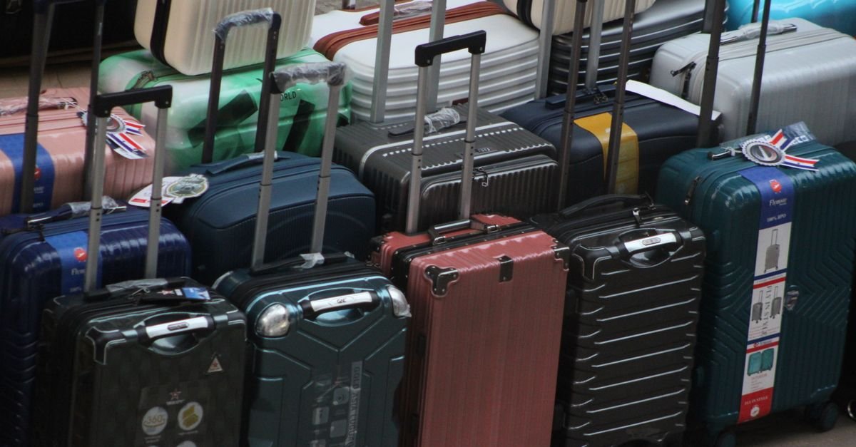 A carry-on suitcase standing in an airport