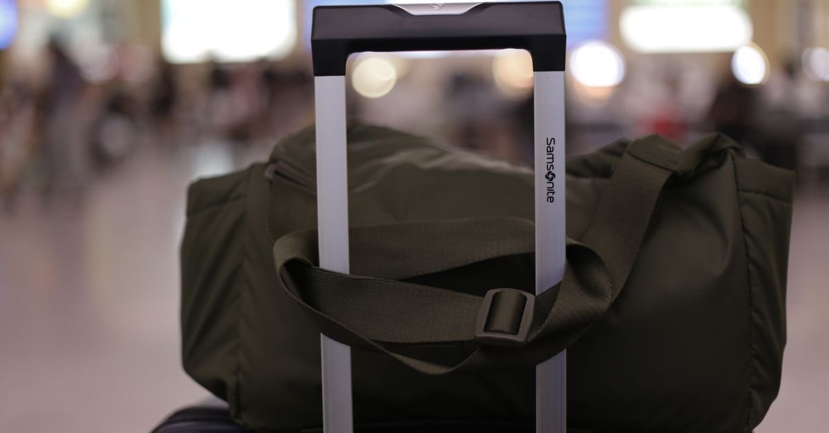 A bag being weighed on a luggage scale