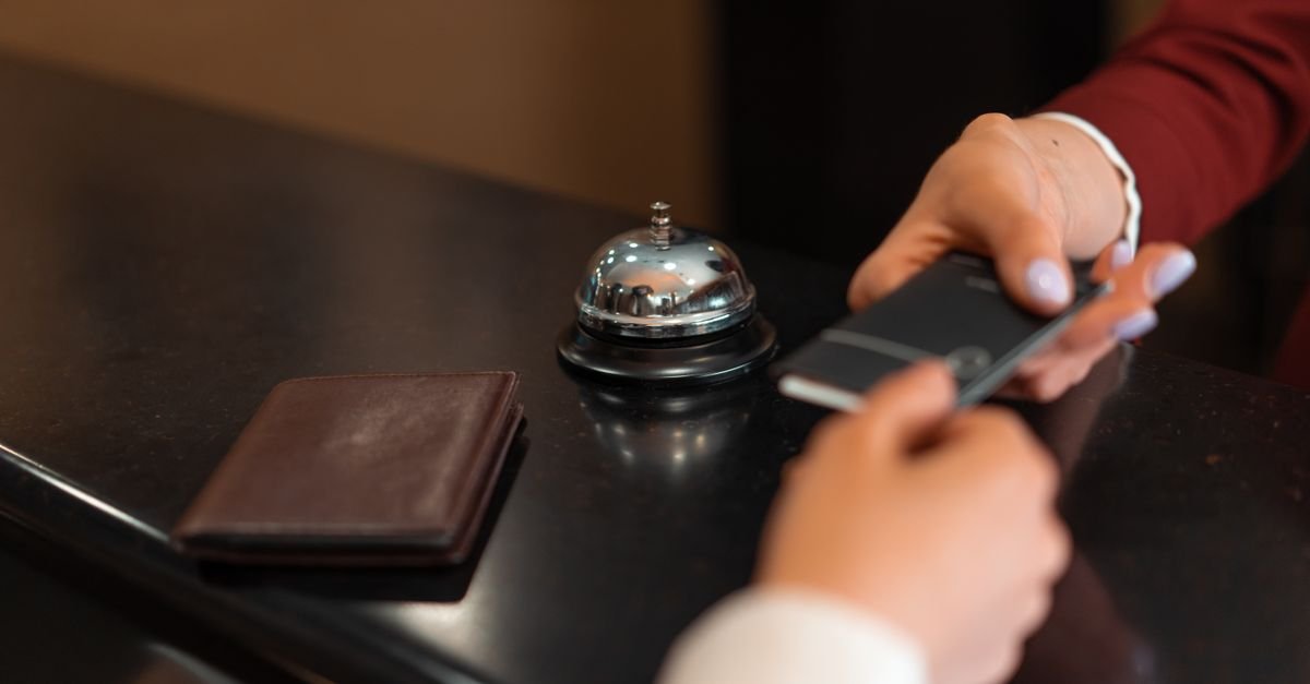 A card machine at a hotel reception desk