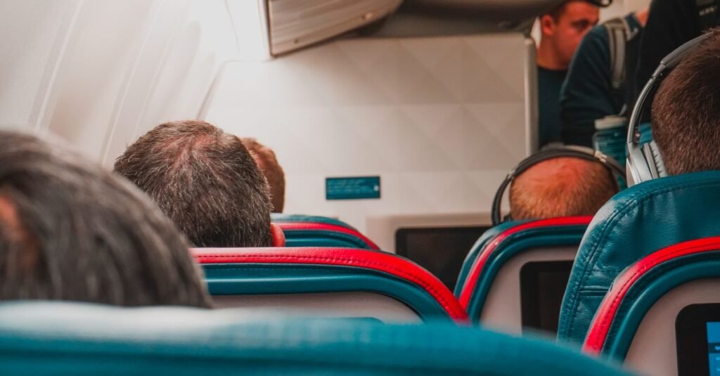 A full aircraft cabin with seated passengers