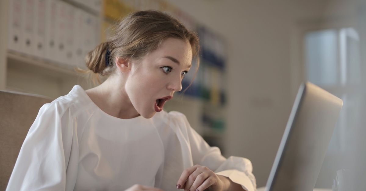 A traveller studying a fare on a laptop screen