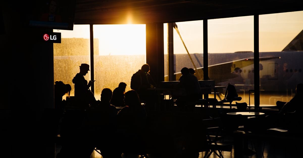 Passengers waiting at an airport gate