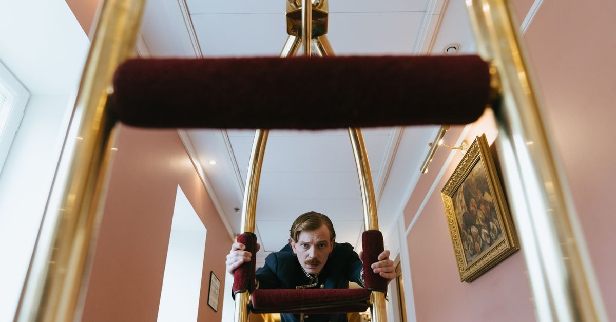 A luggage trolley in a hotel lobby