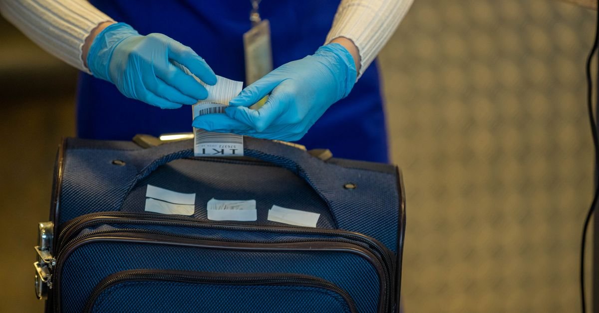 A suitcase on an airport check-in scale