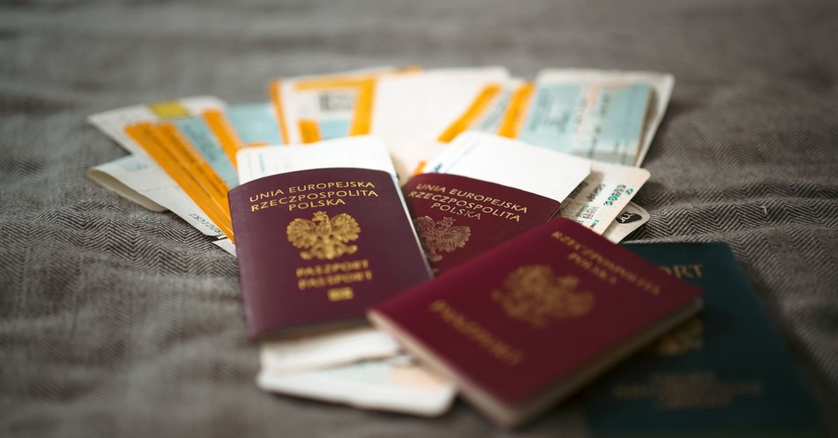 A passport with travel documents on a table