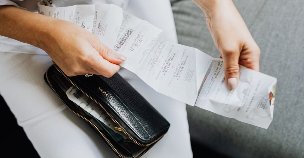 A traveller reviewing receipts