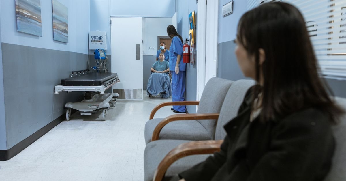 A hospital corridor with a waiting area
